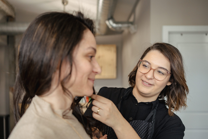 Woman dyeing and cutting her hair in the beauty salon